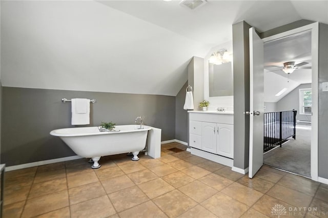 1236 Ridgeview Ave, Kettering, OH 45409 - bathroom with vaulted ceiling, ceiling fan, vanity, and a freestanding tub