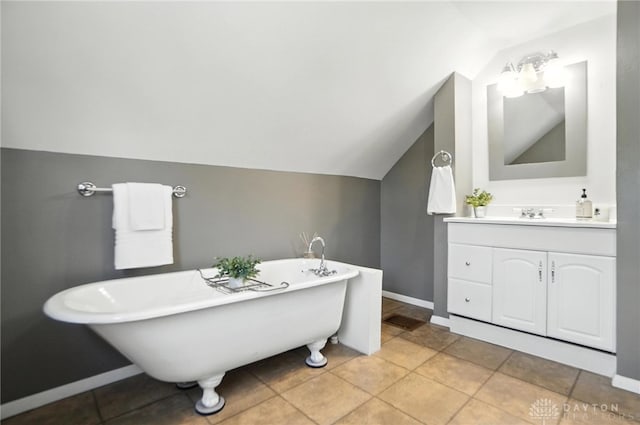 1236 Ridgeview Ave, Kettering, OH 45409 - bathroom with lofted ceiling, a soaking tub, and vanity
