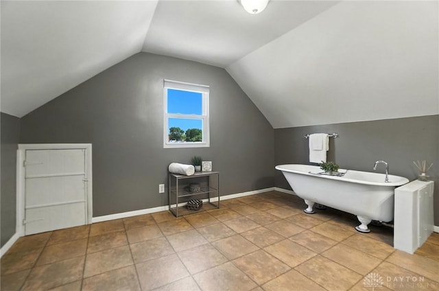 1236 Ridgeview Ave, Kettering, OH 45409 - full bathroom featuring a freestanding bath and vaulted ceiling