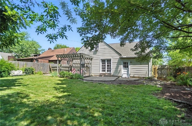1236 Ridgeview Ave, Kettering, OH 45409 - rear view of house with a pergola, a fenced backyard, a patio area, and a shingled roof
