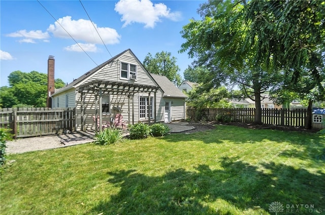 1236 Ridgeview Ave, Kettering, OH 45409 - rear view of property featuring a pergola, a fenced backyard, and a patio