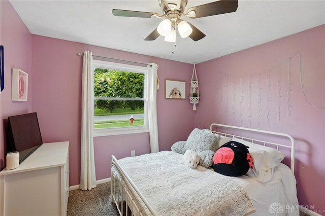 bedroom with carpet, baseboards, and a ceiling fan