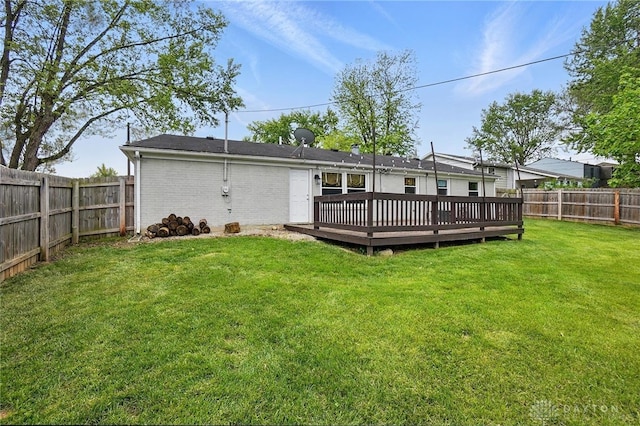 back of house with a deck and brick siding