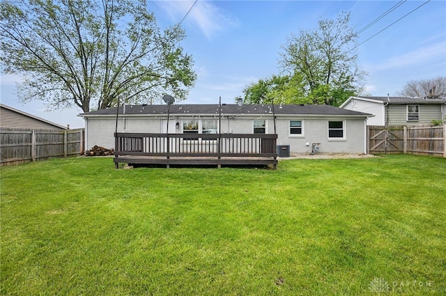 rear view of property with a deck and cooling unit