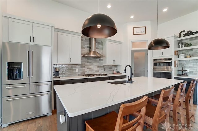 1264 Normandy, Clearcreek Twp, OH 45458 - kitchen featuring appliances with stainless steel finishes, a sink, wall chimney range hood, open shelves, and backsplash