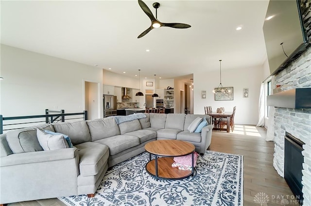 1264 Normandy, Clearcreek Twp, OH 45458 - living area with ceiling fan, a stone fireplace, wood finished floors, and recessed lighting