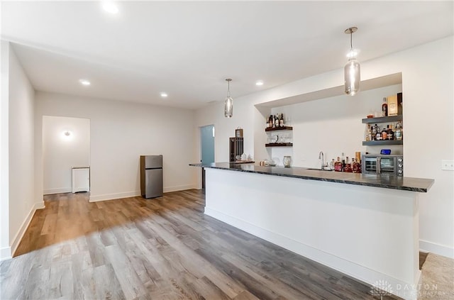 1264 Normandy, Clearcreek Twp, OH 45458 - indoor wet bar featuring freestanding refrigerator, wood finished floors, recessed lighting, pendant lighting, and baseboards