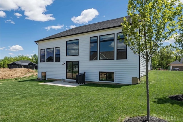 1264 Normandy, Clearcreek Twp, OH 45458 - back of house with a lawn and a patio