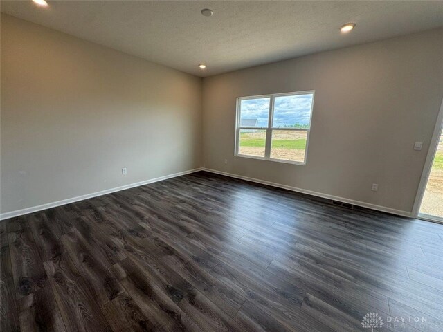 546 Hollywood Blvd, Xenia, OH 45385 - unfurnished room featuring dark wood-style flooring, baseboards, and recessed lighting