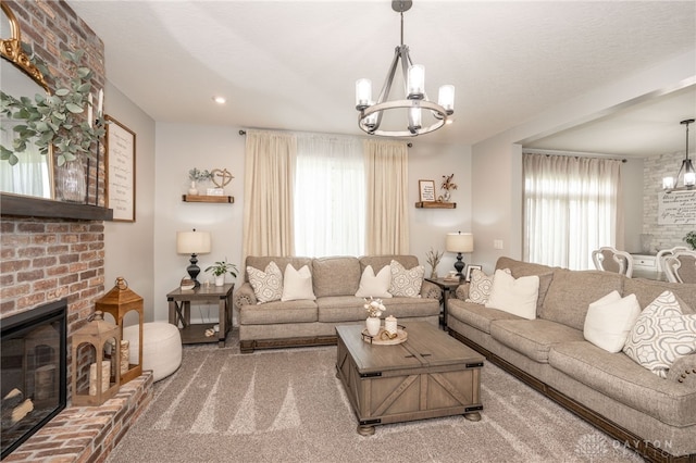 1909 Cleopatra Dr, Franklin, OH 45005 - living room featuring a chandelier, a fireplace, and recessed lighting
