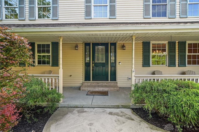 property entrance with covered porch