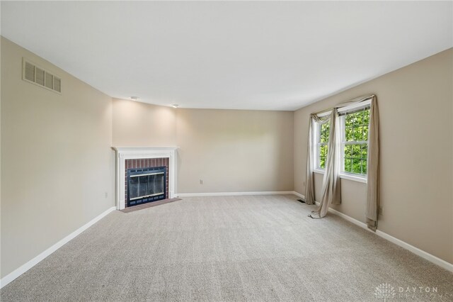 2337 Eastwind Dr, Beavercreek, OH 45434 - unfurnished living room with a fireplace, light carpet, and baseboards