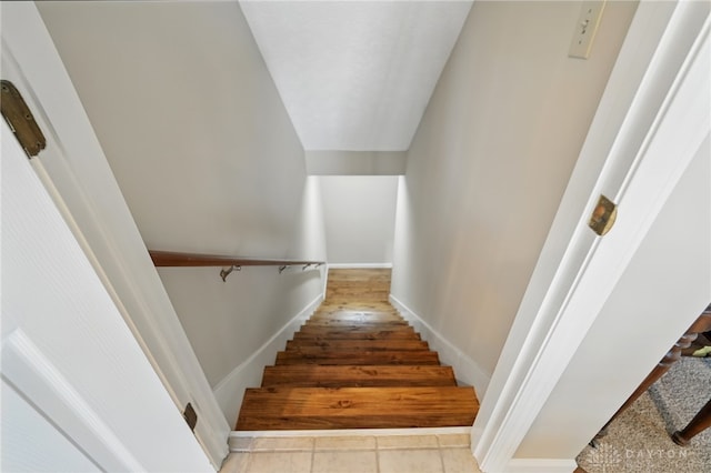 stairway featuring tile patterned floors