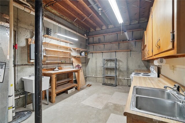 2337 Eastwind Dr, Beavercreek, OH 45434 - unfinished basement featuring a sink and a workshop area
