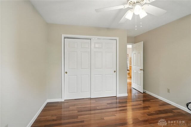2337 Eastwind Dr, Beavercreek, OH 45434 - unfurnished bedroom featuring wood finished floors, baseboards, and a closet
