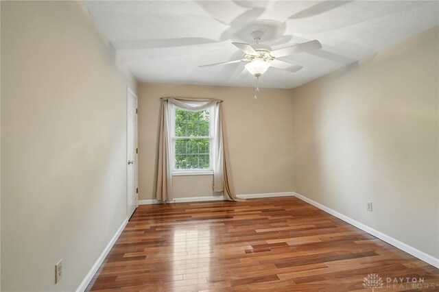 2337 Eastwind Dr, Beavercreek, OH 45434 - empty room featuring a ceiling fan, baseboards, and wood finished floors