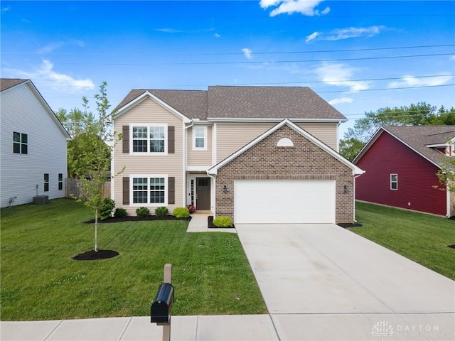 traditional home with an attached garage, concrete driveway, a front lawn, and brick siding