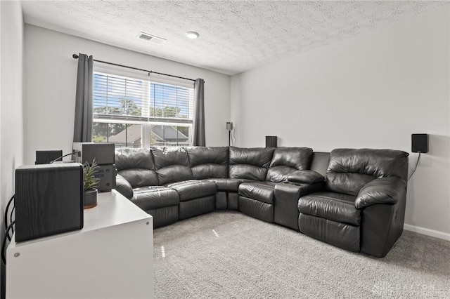 living area featuring carpet floors and a textured ceiling