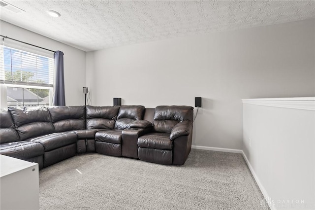 living room featuring carpet flooring, a textured ceiling, and baseboards