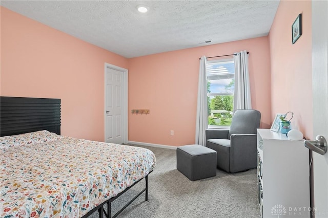 bedroom featuring carpet flooring, baseboards, a textured ceiling, and recessed lighting