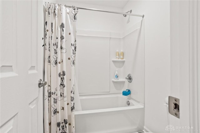 bathroom with shower / tub combo with curtain