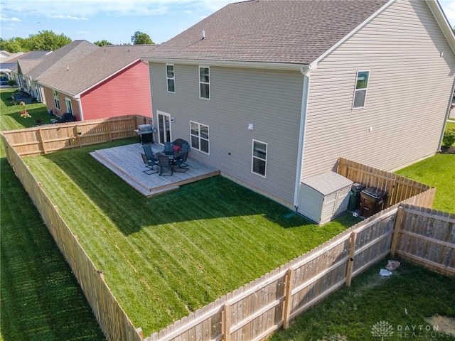 rear view of house featuring a deck