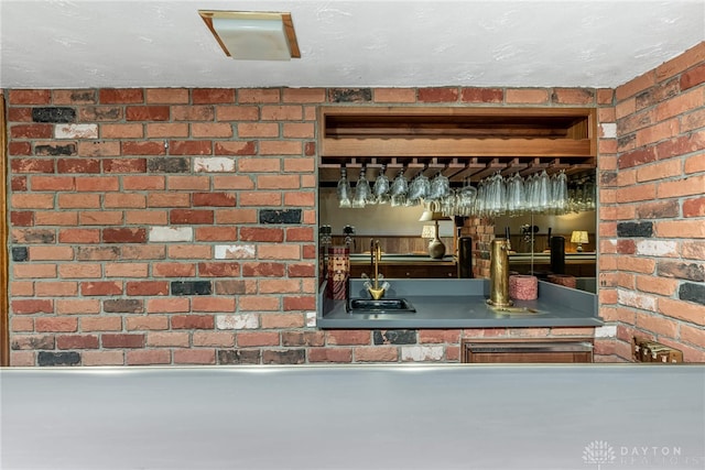 detailed view of wet bar and brick wall
