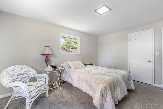 bedroom featuring carpet flooring and baseboards