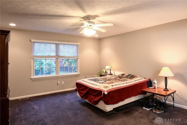 4826 Beechwood Ln, Middletown, OH 45042 - bedroom with baseboards, carpet flooring, ceiling fan, and a textured ceiling