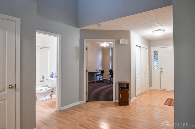 4826 Beechwood Ln, Middletown, OH 45042 - entrance foyer featuring baseboards, light wood-style floors, and a textured ceiling