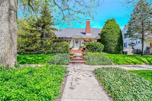 401 Hadley Ave, Dayton, OH 45419 - view of front facade with a chimney and a front yard