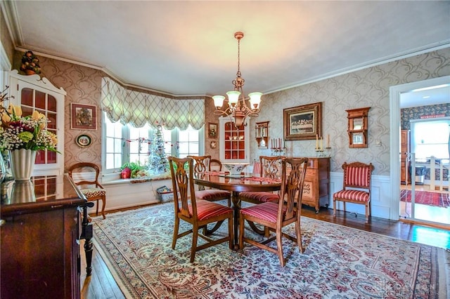 401 Hadley Ave, Dayton, OH 45419 - dining area with wallpapered walls, ornamental molding, hardwood / wood-style floors, a chandelier, and wainscoting