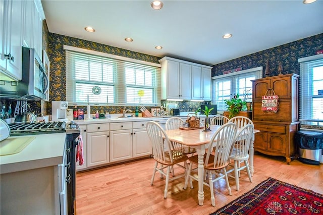 401 Hadley Ave, Dayton, OH 45419 - dining area with wallpapered walls, light wood-type flooring, and recessed lighting