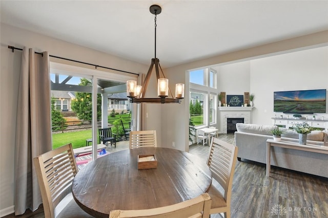 1535 Mulberry Ct, Turtlecreek Twp, OH 45036 - dining space with a chandelier, plenty of natural light, and wood finished floors