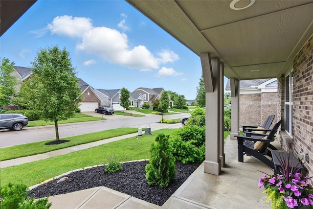 1535 Mulberry Ct, Turtlecreek Twp, OH 45036 - porch featuring a residential view and a yard