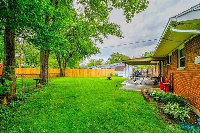 201 Applegate Rd, Union, OH 45322 - fenced backyard featuring a storage shed and a patio