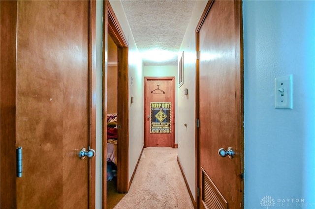 201 Applegate Rd, Union, OH 45322 - hallway with a textured ceiling, light colored carpet, and baseboards