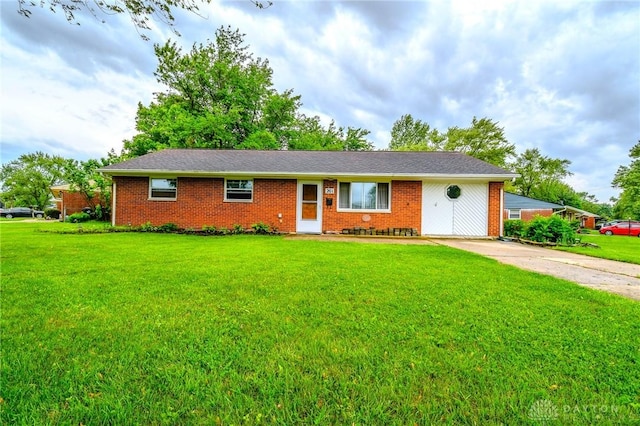 201 Applegate Rd, Union, OH 45322 - single story home with brick siding, a front yard, and concrete driveway