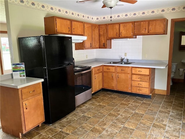 201 Applegate Rd, Union, OH 45322 - kitchen with stainless steel electric stove, ceiling fan, freestanding refrigerator, brown cabinetry, and light countertops