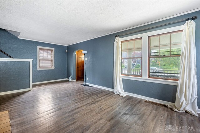 57 W Maplewood Ave, Dayton, OH 45405 - unfurnished room with a textured ceiling, wood finished floors, arched walkways, and a textured wall