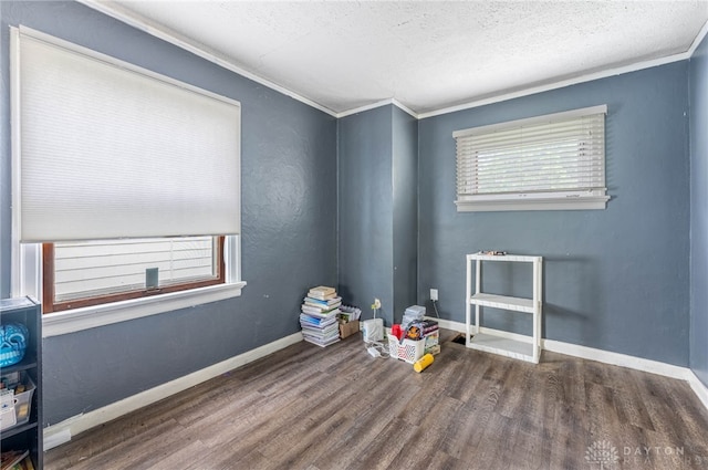 57 W Maplewood Ave, Dayton, OH 45405 - empty room with wood finished floors, a textured ceiling, and ornamental molding