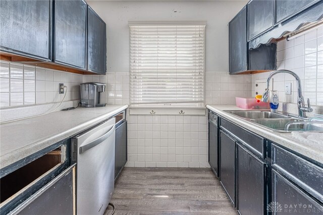 57 W Maplewood Ave, Dayton, OH 45405 - kitchen with dishwasher, tile walls, light wood-style floors, and light countertops