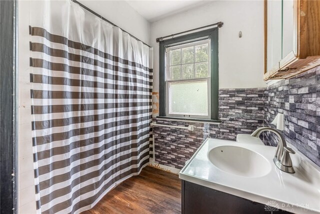 57 W Maplewood Ave, Dayton, OH 45405 - full bath with wood finished floors, vanity, and curtained shower