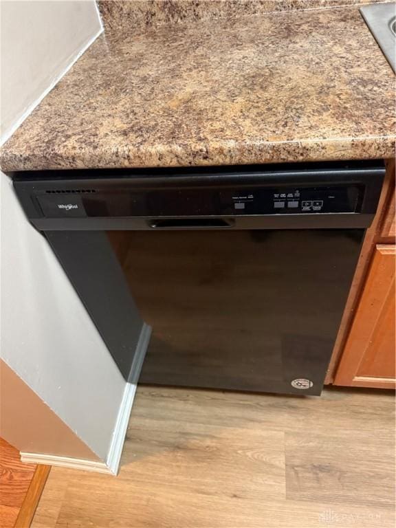 1109 Arrowhead Xing Unit A, West Carrollton, OH 45449 - kitchen view of black dishwasher and light wood-style flooring