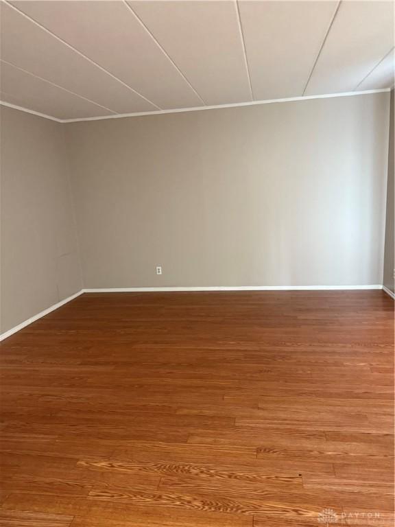 1109 Arrowhead Xing Unit A, West Carrollton, OH 45449 - empty room with wood finished floors and baseboards