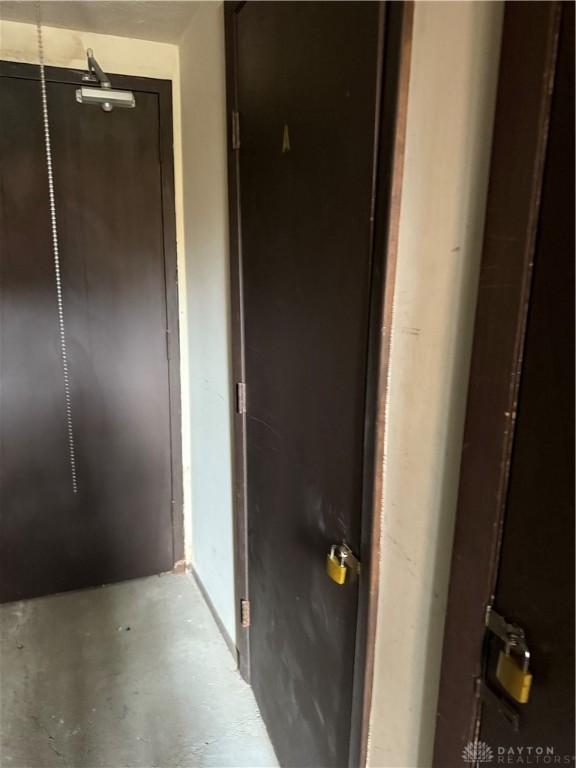 1109 Arrowhead Xing Unit A, West Carrollton, OH 45449 - hallway with concrete floors