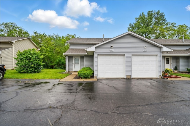 9670 Centerville Creek Ln, Washington Twp, OH 45458 - view of front facade featuring a garage, driveway, a front lawn, and a shingled roof