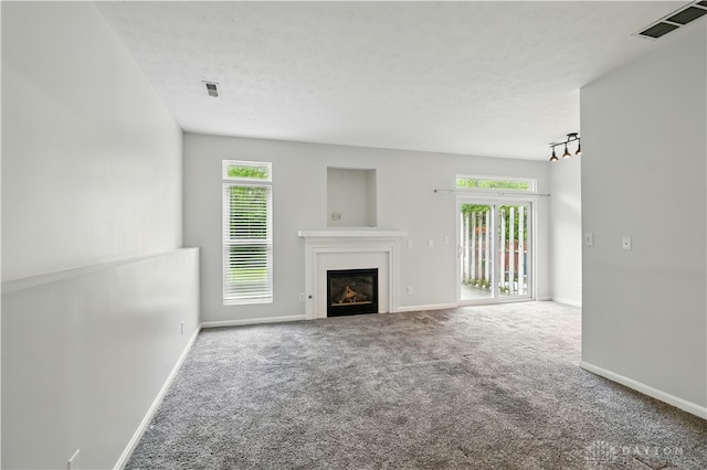 9670 Centerville Creek Ln, Washington Twp, OH 45458 - unfurnished living room featuring carpet floors, a glass covered fireplace, and baseboards