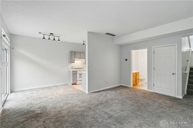 9670 Centerville Creek Ln, Washington Twp, OH 45458 - unfurnished living room featuring light carpet, stairs, and baseboards