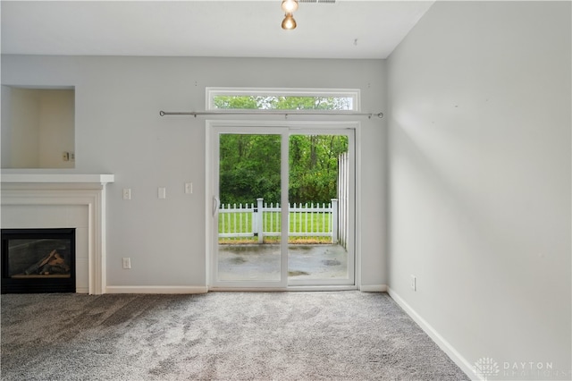 9670 Centerville Creek Ln, Washington Twp, OH 45458 - unfurnished living room featuring carpet floors, baseboards, and a glass covered fireplace